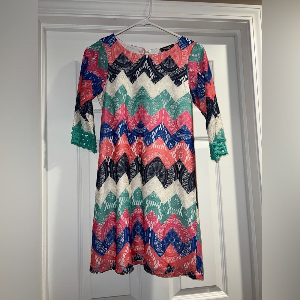 This is a multicolored casual little girls dress by sequin heart